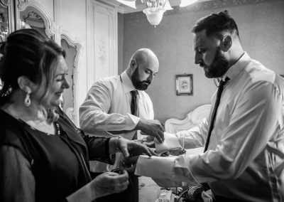 Groom preparation with his mother, wedding reportage