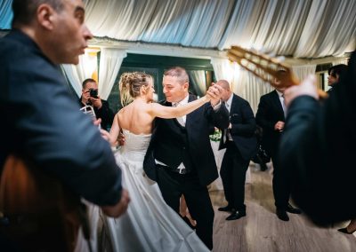 Newlyweds dancing during a wedding in Italy