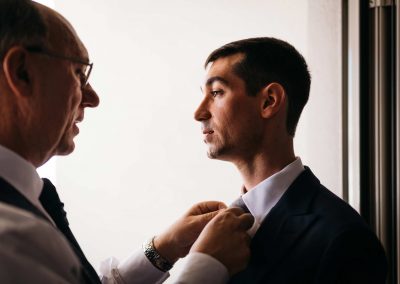 Groom preparation with his father, wedding reportage