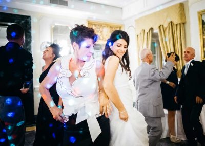 Mother dancing with the bride during a wedding in Italy