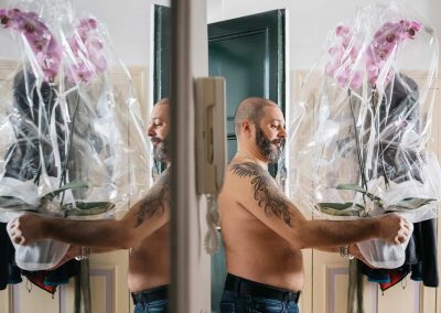 Groom preparation with a flower in a wedding in rome